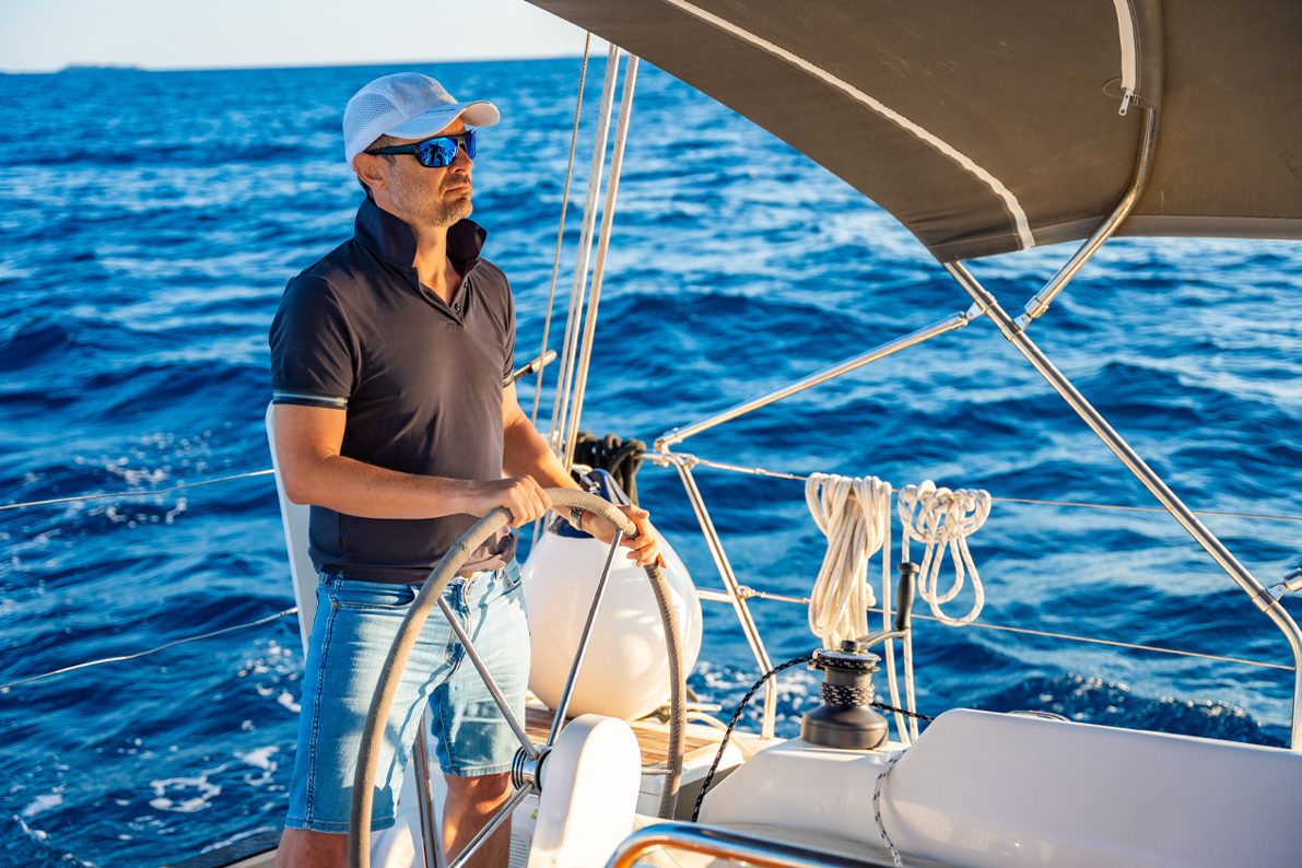 Captain Ethan at the helm, focused on the water